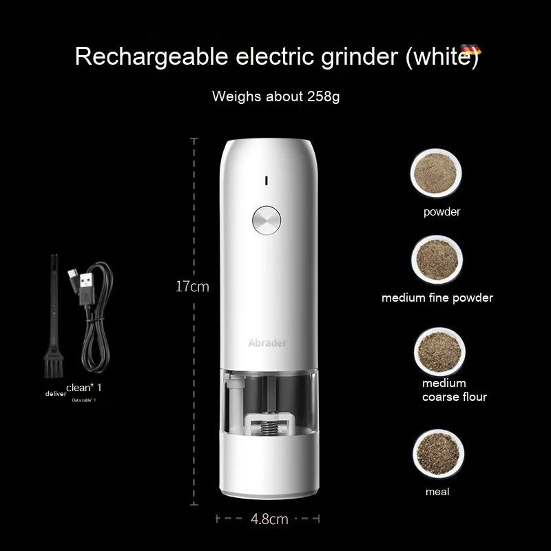 Black and white electric salt and pepper grinder set with USB charging cable on a kitchen worktop.