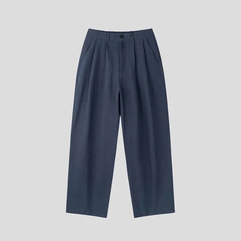 Men's apricot wide-leg cotton linen trousers with a loose fit and pencil leg opening.