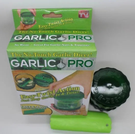 Green transparent silicone garlic peeler tube on a kitchen counter