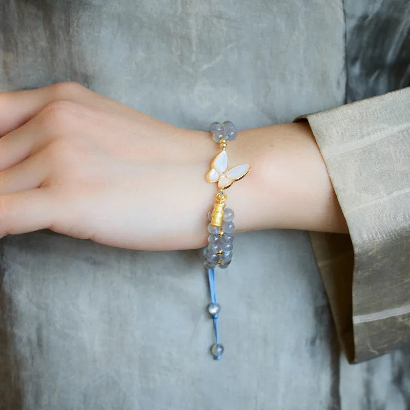 Grey moonstone woven bracelet for women with geometric design and butterfly detailing