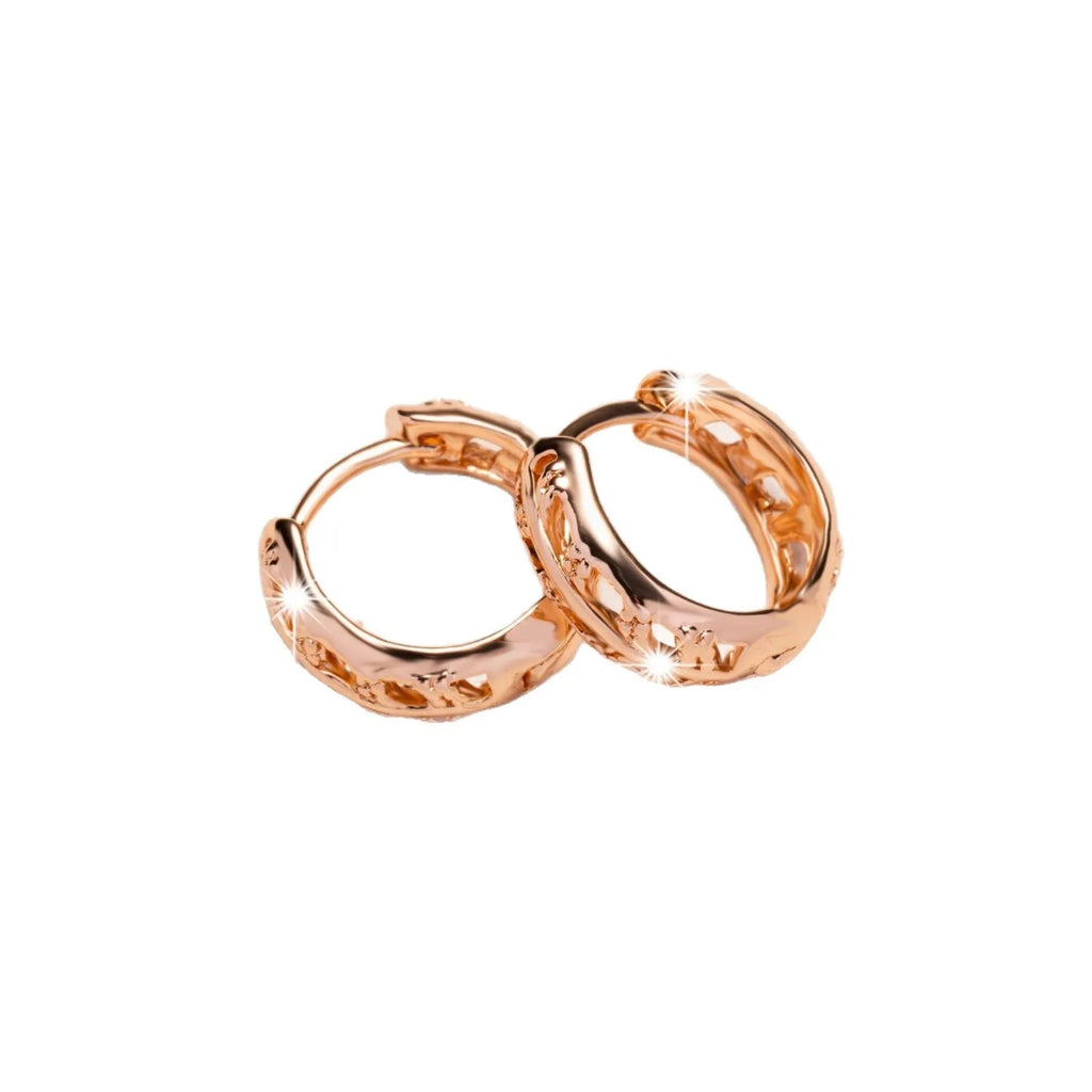 Rose gold hollowed-out copper earrings in heart and leaf shapes
