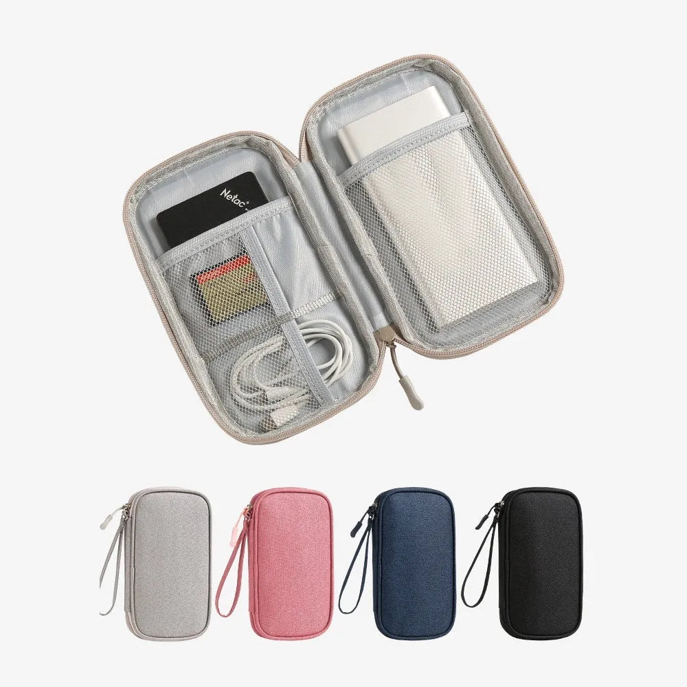 Portable data cable buggy bag in light gray, handbag style, 19x11x3 cm, on flat surface