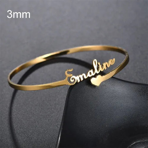 Personalised name bracelet in stainless steel with 10mm width, shown in silver, gold, or rose gold