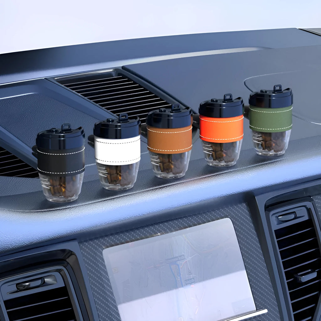 Coffee cup shaped car air freshener in solid fragrance format with plastic construction