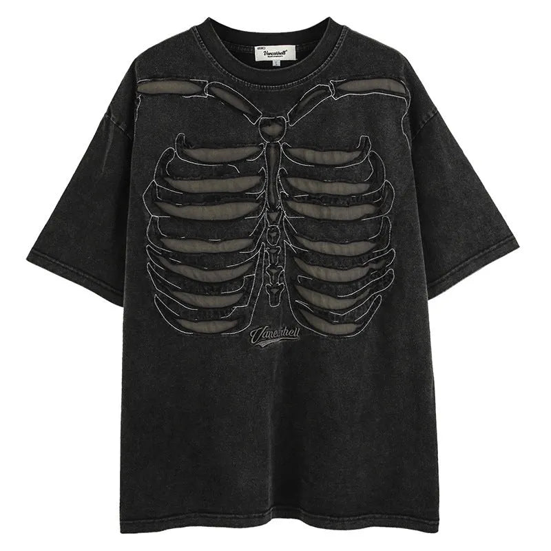 Man modelling a black loose-fit cotton short sleeve top with a white skull and letter graphic print.