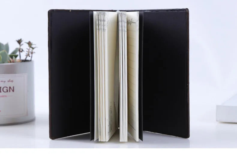 PU leather embossed retro notebook with Bronze relief cover showing beige inner pages