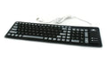 Folding waterproof silicone keyboard in pink with USB cable on a desk