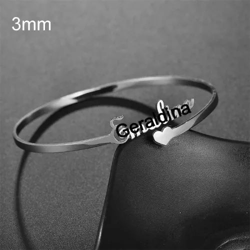 Personalised name bracelet in stainless steel with 10mm width, shown in silver, gold, or rose gold