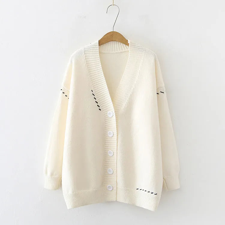Women's loose fit knitted cardigan coat in black, long sleeve open front design.