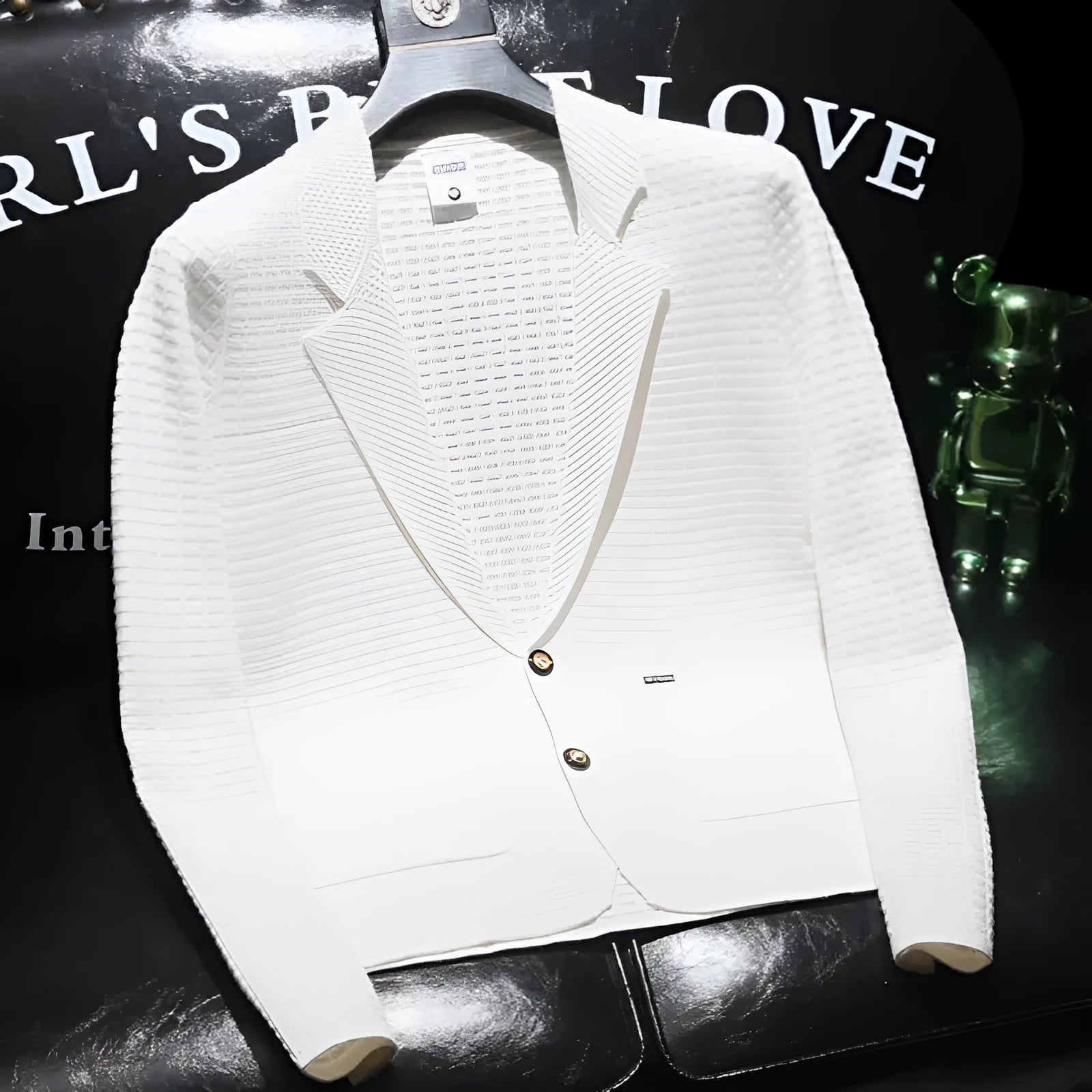 White men's thin V-neck suit jacket on a hanger, showing solid colour and smart-casual styling.