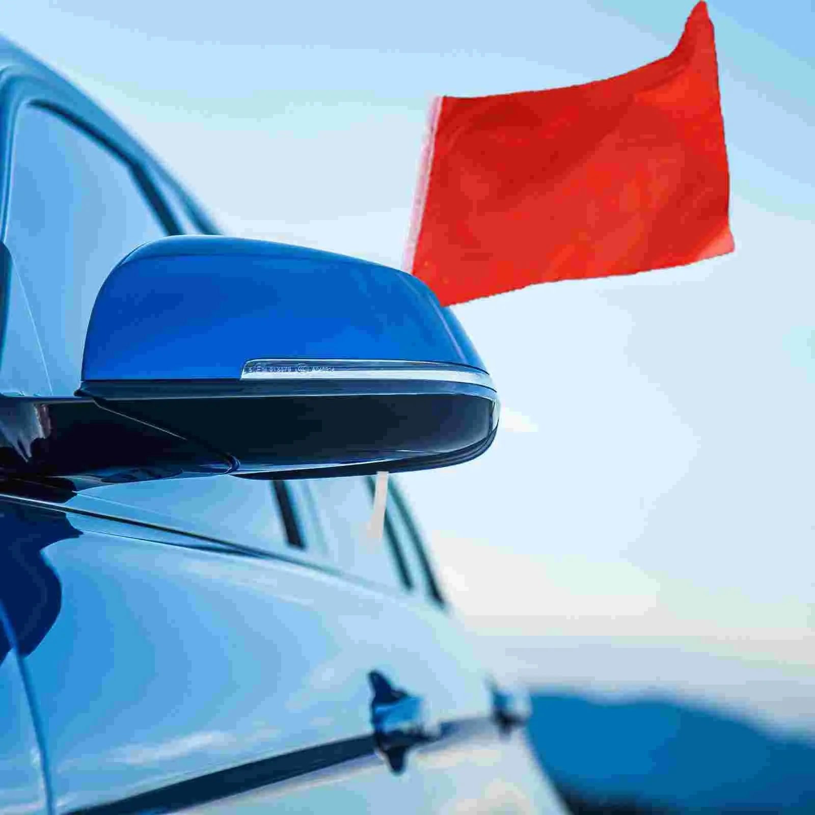 White plastic car window flag holder clip shown mounted on a vehicle window.