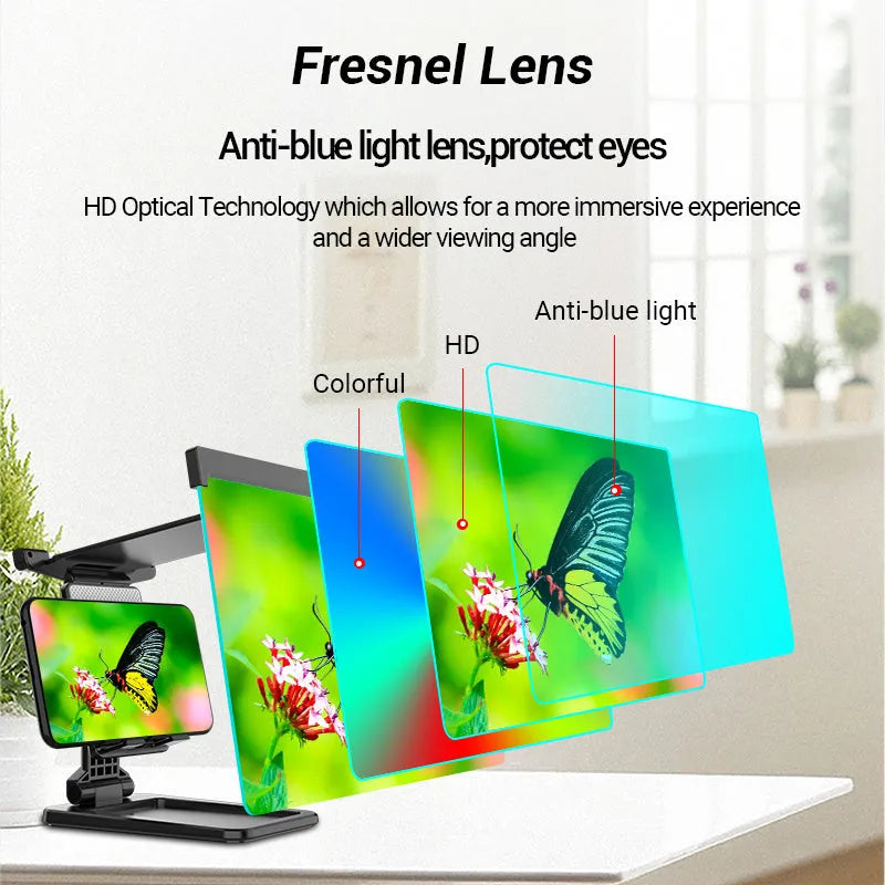 Black foldable mobile phone screen amplifier with a detachable phone holder on a desktop.