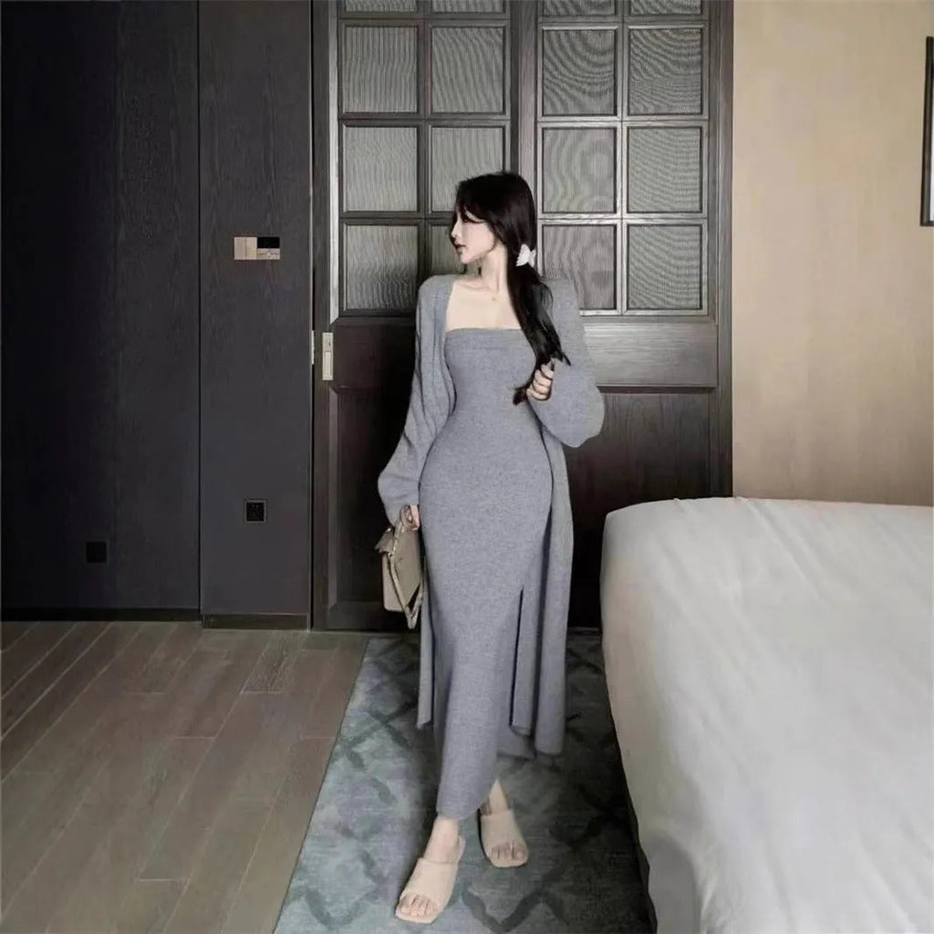 Women's grey knitted cardigan dress and matching coat set on a hanger.