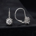Sterling silver flower bud clip earring with moissanite stone and electroplated platinum finish.