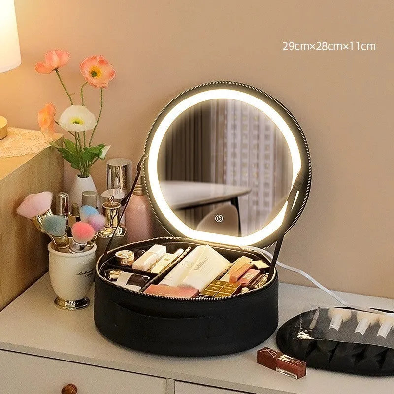 Round pink PU leather makeup bag with LED mirror open, showing internal partitions and carry strap.