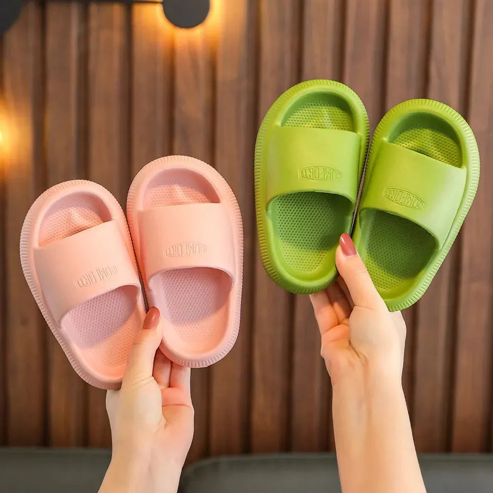 Children's colourful EVA slippers with a non-slip sole on a white background.