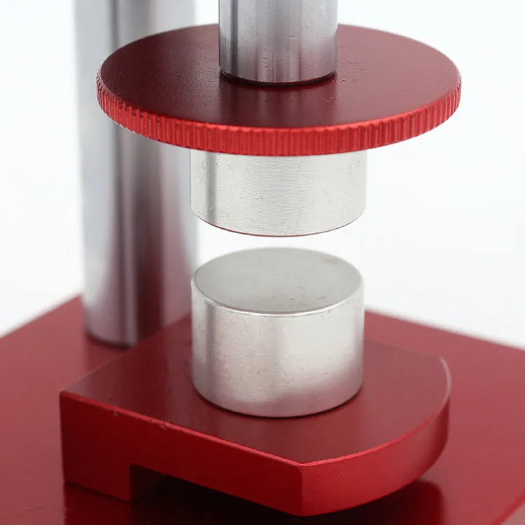 Watch repair spiral cap presser tool with a set of twenty plastic moulds for watch back covers.