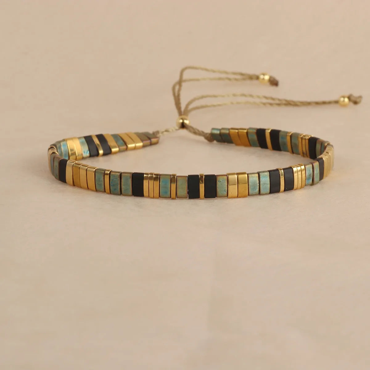 Geometric pull bead bracelet with round glass beads in five colour options