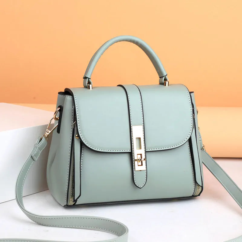 Soft PU leather women's messenger bag in square vertical design with adjustable shoulder strap.