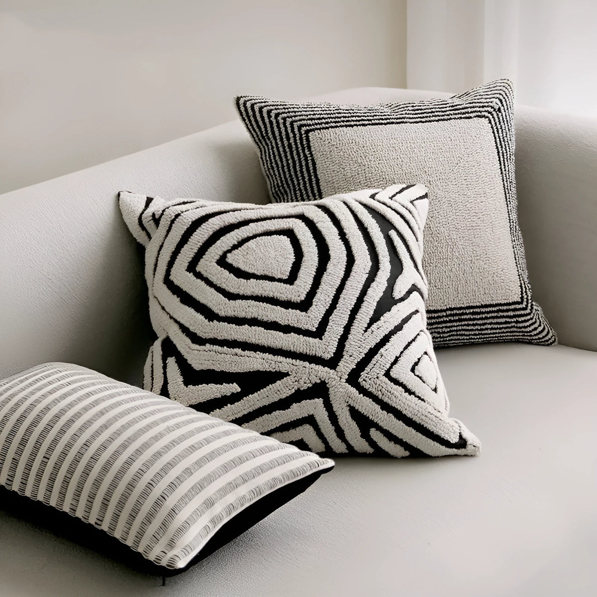 Black and white geometric towel embroidery cushion in 50x50cm square and 30x50cm waist pillow formats for sofa and living room.