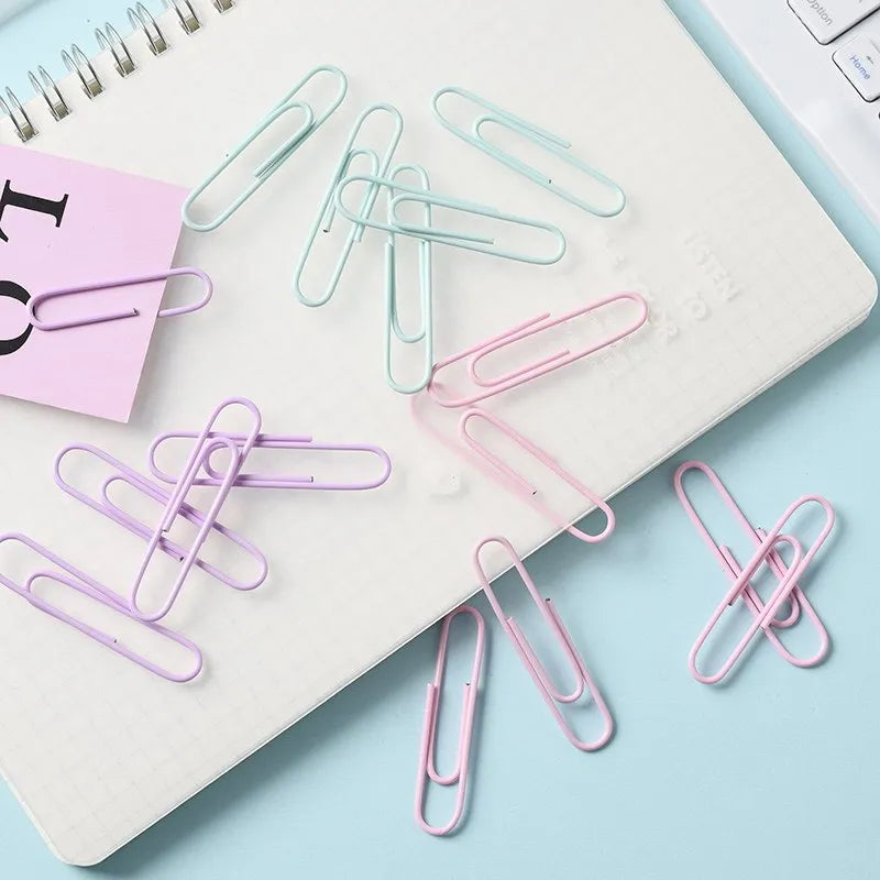 Macaron colour alloy paper clips in pink, purple, and green, 50mm large and 28mm small sizes.