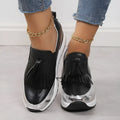Women's black casual platform shoes with tassel detail and wedge heel