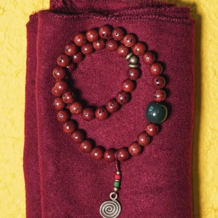 Bodhi seed double circle bracelet with cartoon charms on wrist