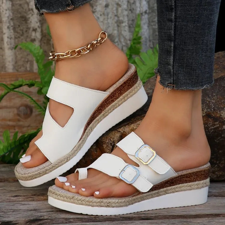White patent leather wedge sandals with woven upper and peep toe design