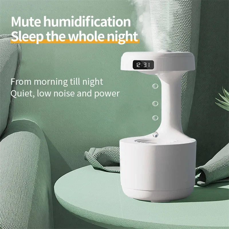 White anti-gravity humidifier with LED clock display emitting mist on a wooden desk.