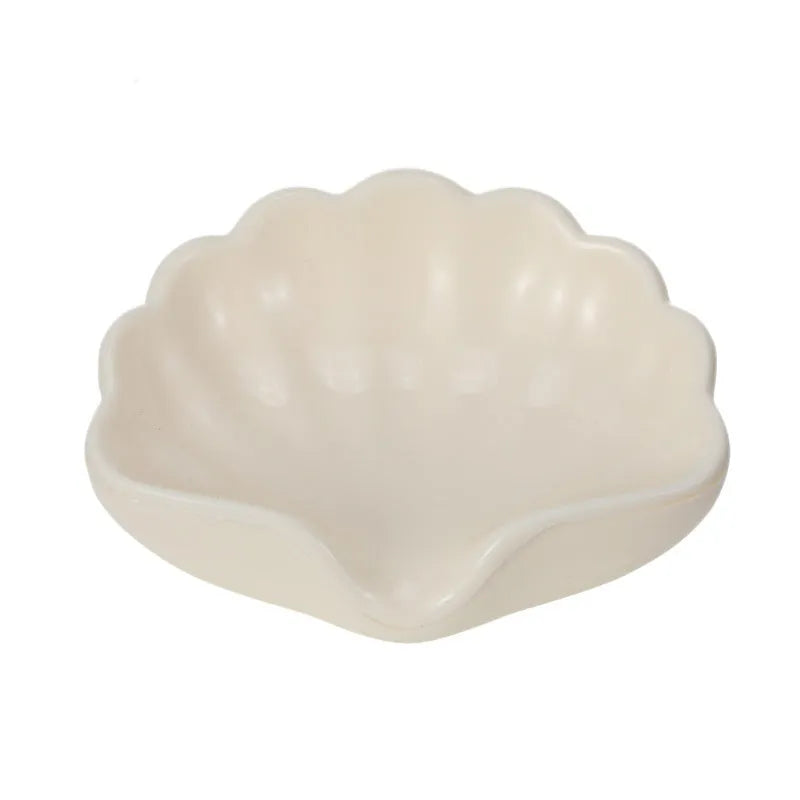 White shell-shaped plastic soap dish for bathroom countertops