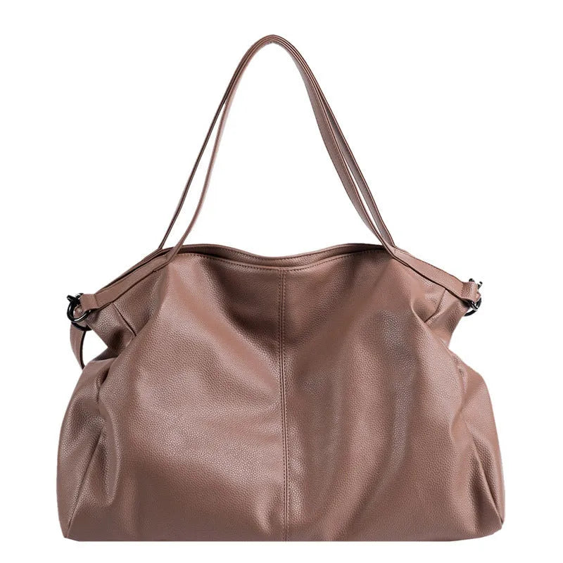 Large soft surface messenger bag in black with adjustable shoulder strap and zip opening
