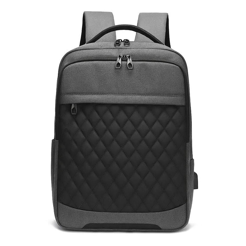 Men's solid colour Oxford cloth backpack with curved shoulder strap in black, blue, or grey.