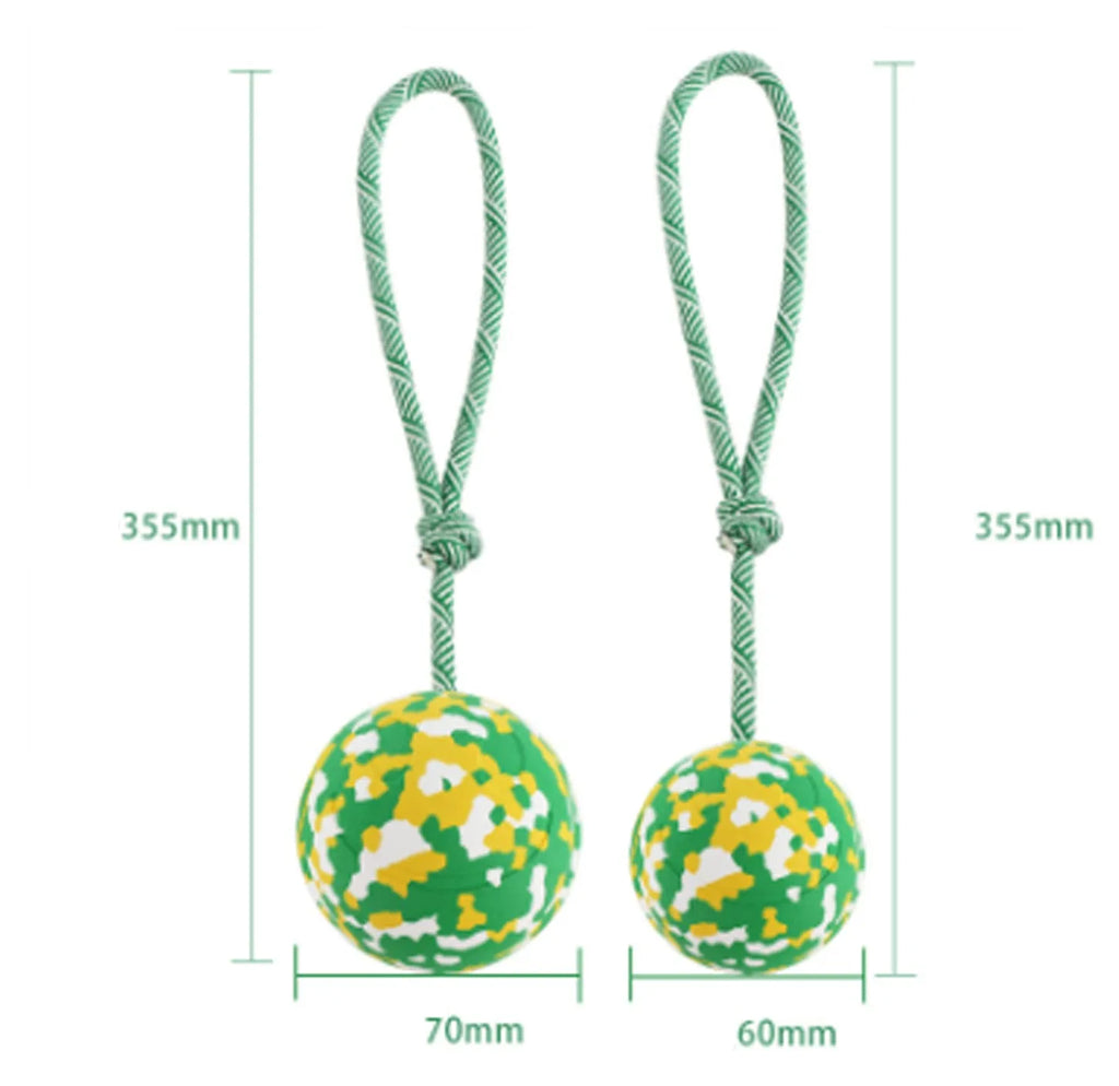 Natural rubber dog ball attached to a blue nylon rope for fetch and tug play