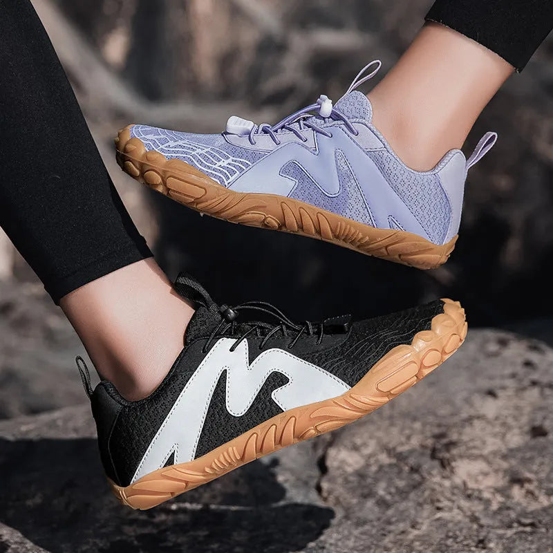 Unisex flyknit-lined climbing shoes with rubber sole in multiple colour options on a climbing hold.