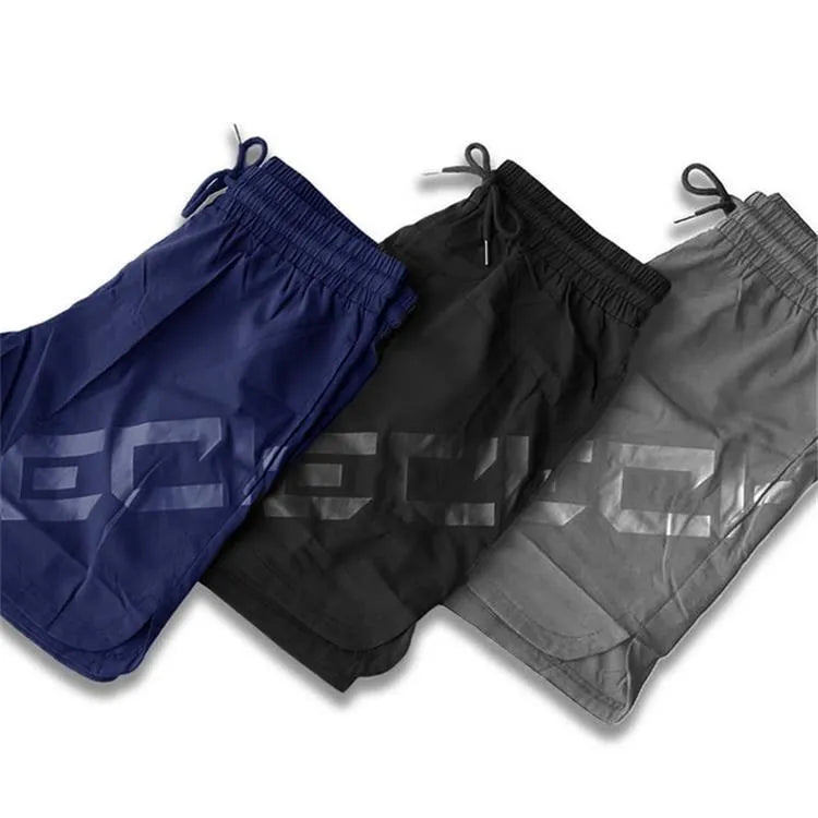 Men's black quick-dry nylon running shorts with mid-length cut for summer training