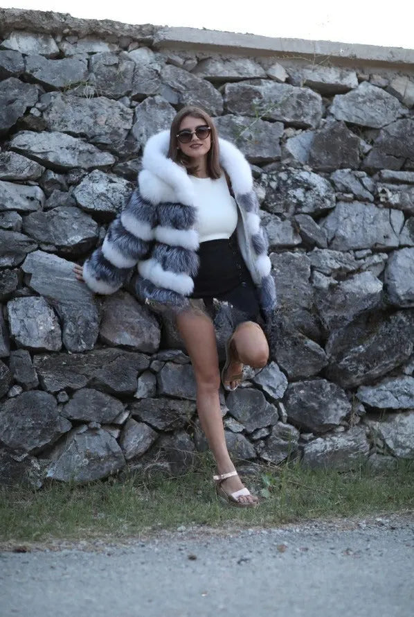 Women's brown artificial fur hooded coat on a hanger, street fashion style.