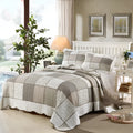 Quilted pure cotton bedspread set with two pillowcases on a bed, showing Korean style and non-slip texture.
