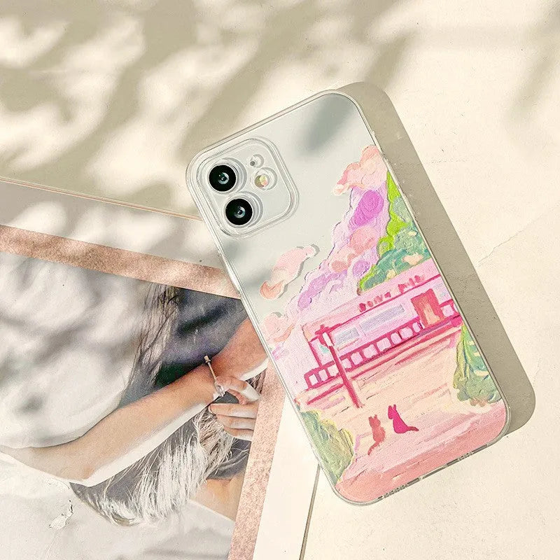 Soft silicone iPhone case with colourful two-cat cartoon design on the back.