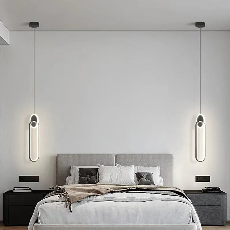 Modern black double ring Nordic pendant lamp hanging from ceiling with adjustable cable.