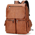 Vintage canvas backpack with sewing thread accents in brown, holding a 14-inch laptop