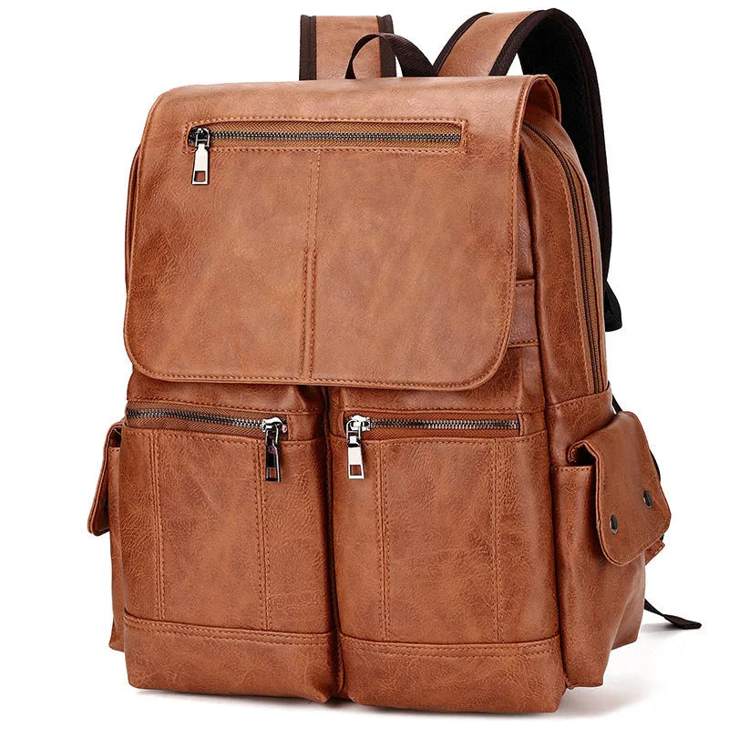 Vintage canvas backpack with sewing thread accents in brown, holding a 14-inch laptop
