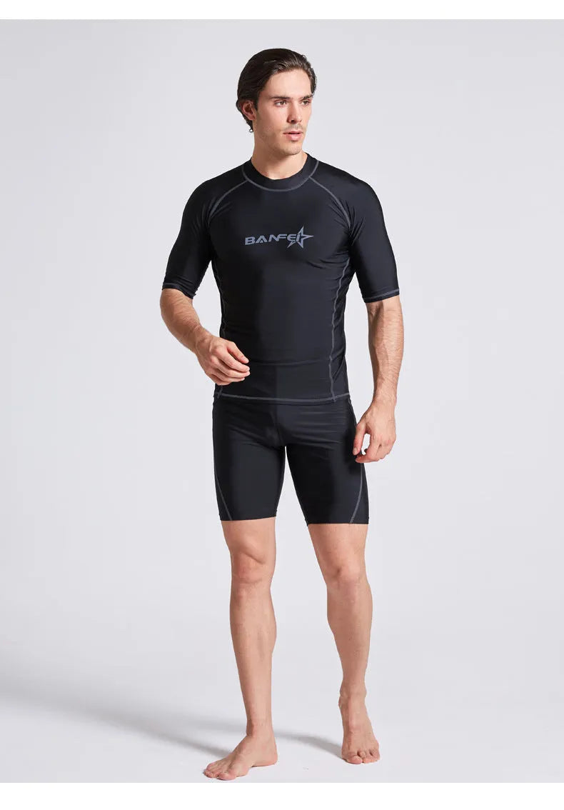Men's quick-dry half sleeve swimsuit suit for snorkelling, showing separate nylon top and pants.
