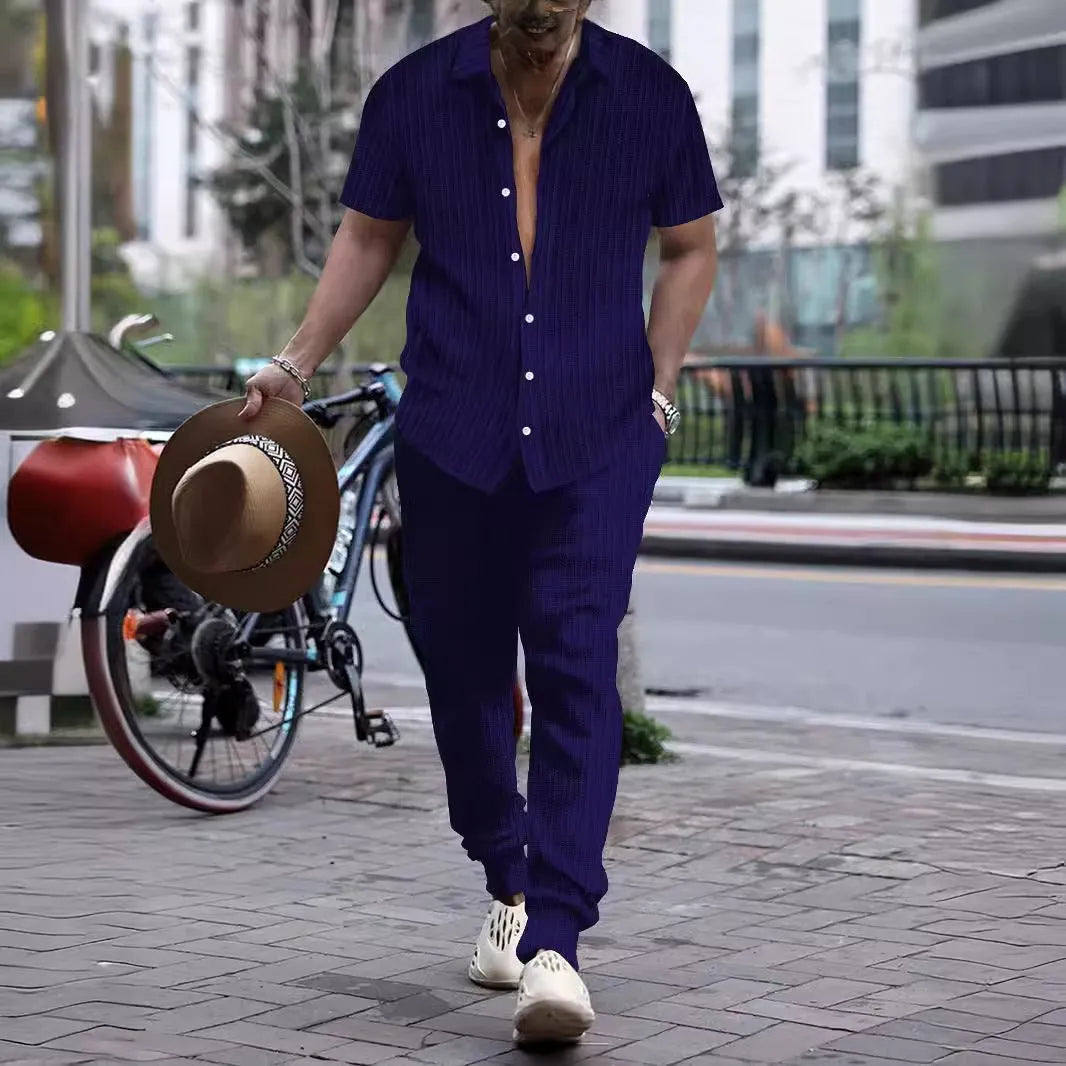 Men's loose-fit casual shirt and trousers suit in a cotton blend fabric, shown in a light blue colour.