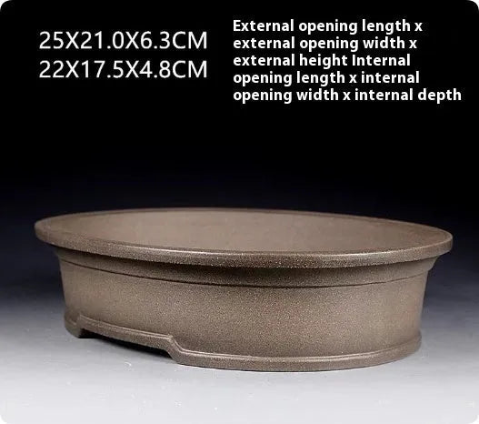 Handmade antique oval bonsai pot in purple sand clay measuring 25cm by 21cm