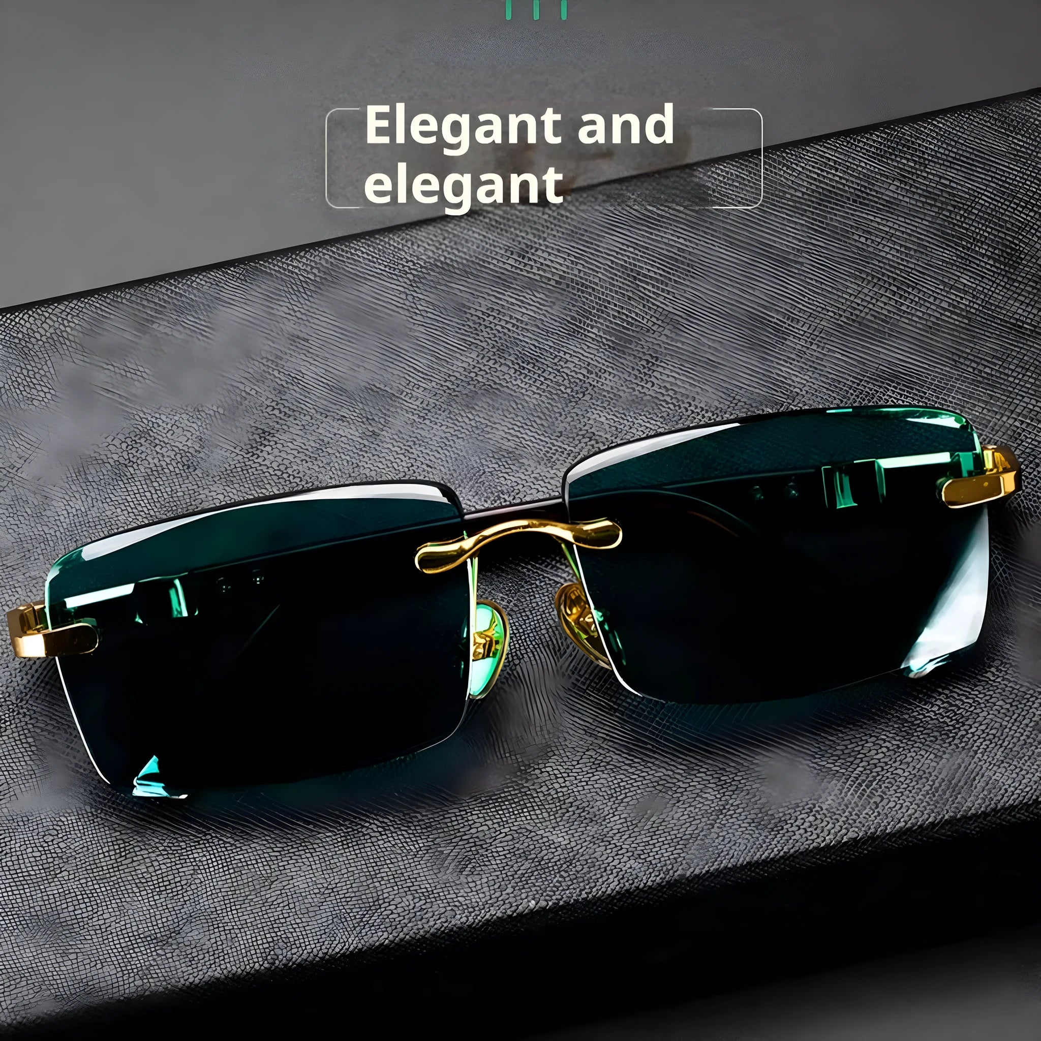 A pair of dark green frameless crystal sunglasses with a hard case and a lens cloth on a plain background.