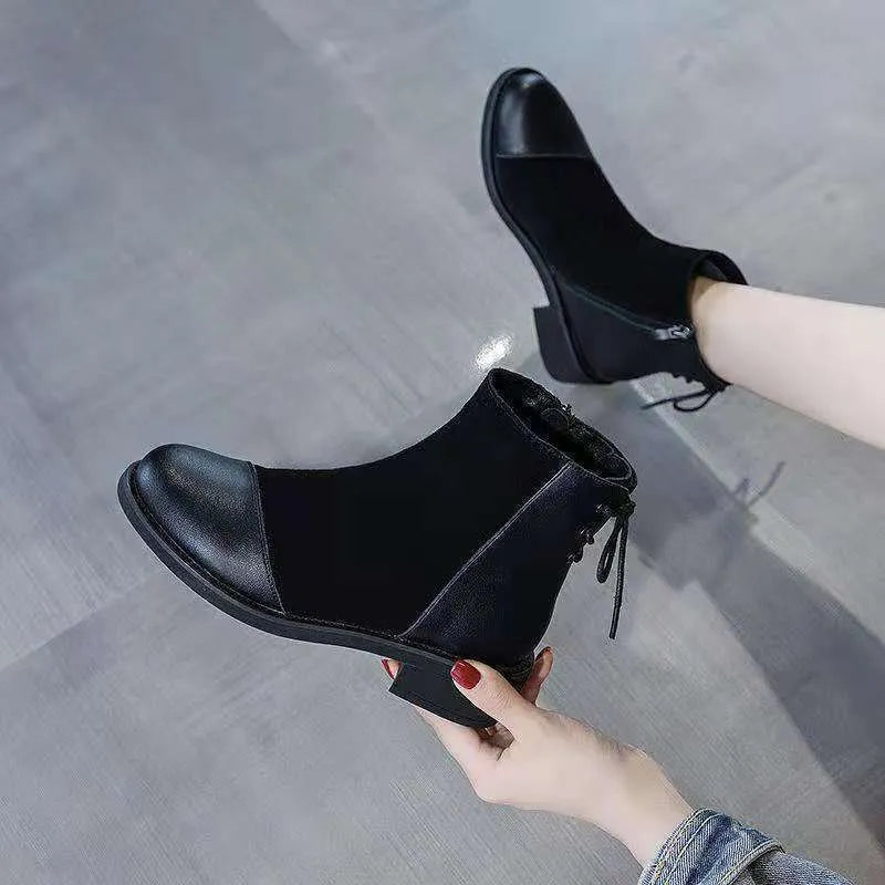 Black women's above-the-knee Martin boots with a side zipper, round toe, and decorative bow.