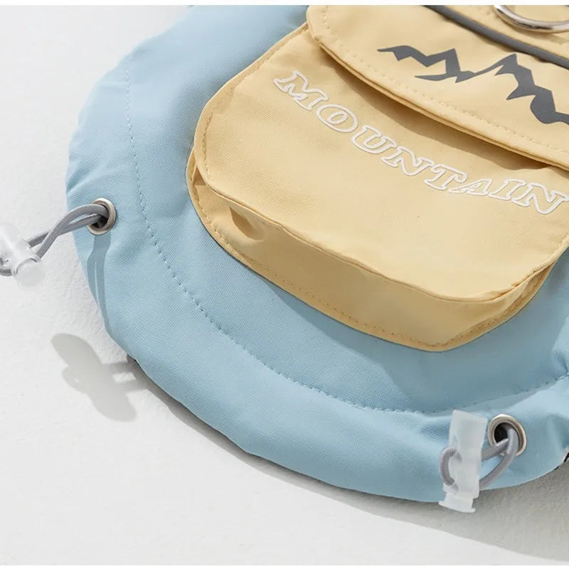 Xidao Di two-legged dog windbreaker coat in sunny yellow-blue colour on a small dog, with adjustable drawstring and D-ring.