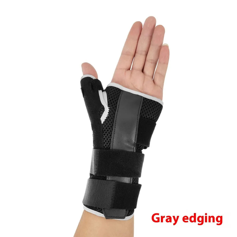 Black carbon fibre sports wrist guard with grey edging and an adjustable thumb strap laid flat.