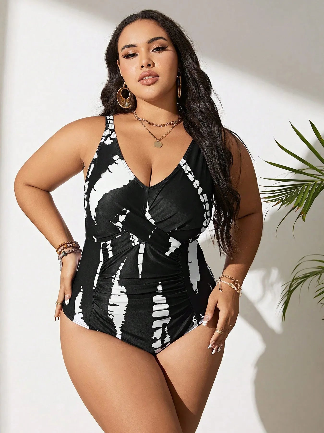 Black conservative one-piece swimsuit with sleeveless design and high-elasticity polyester construction