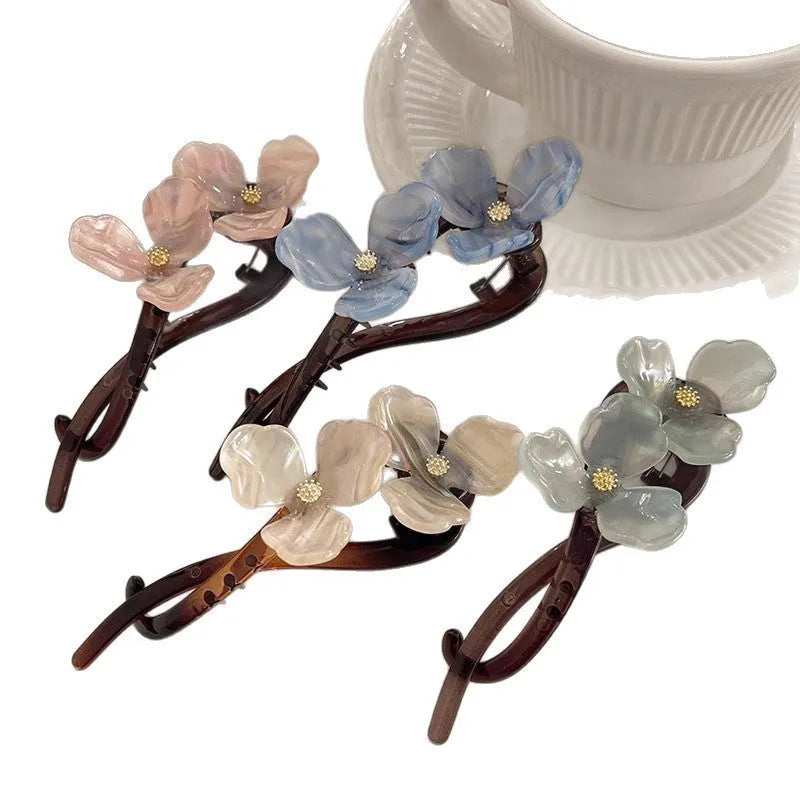 Retro flower design bobby pin hair accessory with acrylic petals in blue, beige, or pink.